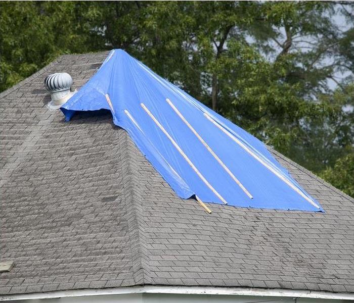 top of roof with tarping on section