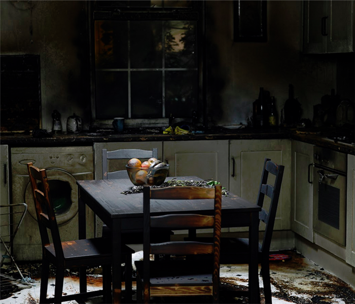 kitchen covered with soot from fire damage